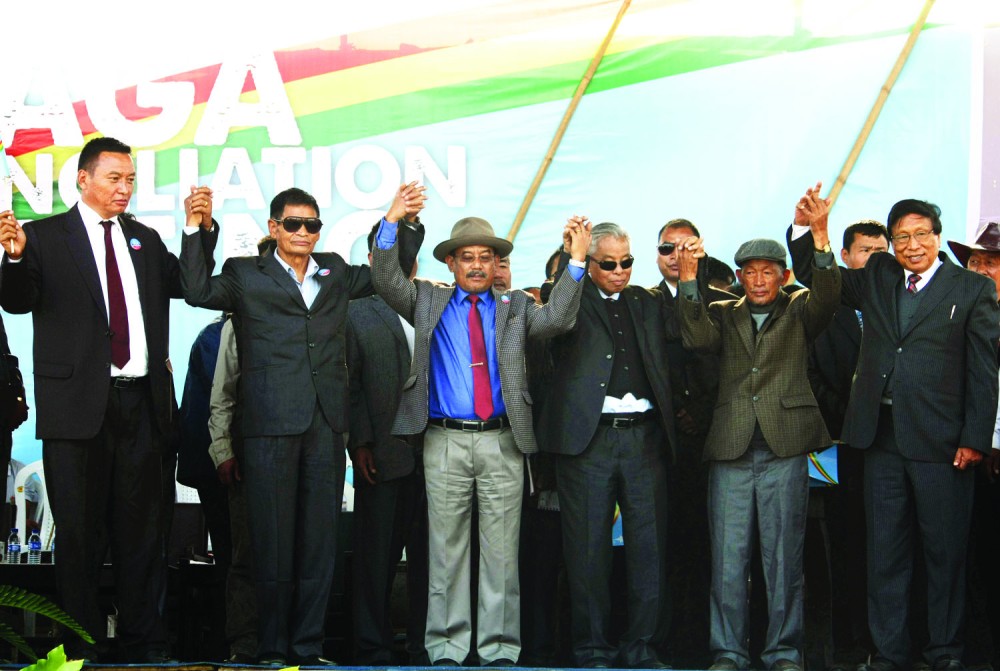 In unity lies the strength to move forward: Leaders of the three national groups hold hands to affirm their support for Naga reconciliation at Agri Expo Center on Wednesday. (From Left to Right): Zhopra Vero, Vice President NNC/FGN; ‘Brig’ (retd) S Singnya, President NNC/FGN; Kitovi Zhimomi, General Secretary GPRN/NSCN; Isak Chishi Swu, Chairman NSCN/GPRN; Gen (retd) Khole Konyak, Chairman GPRN/NSCN and Th. Muivah, General Secretary NSCN/GPRN (Photos by Caisii Mao)